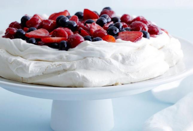 Berry Pavlova dessert white red blue